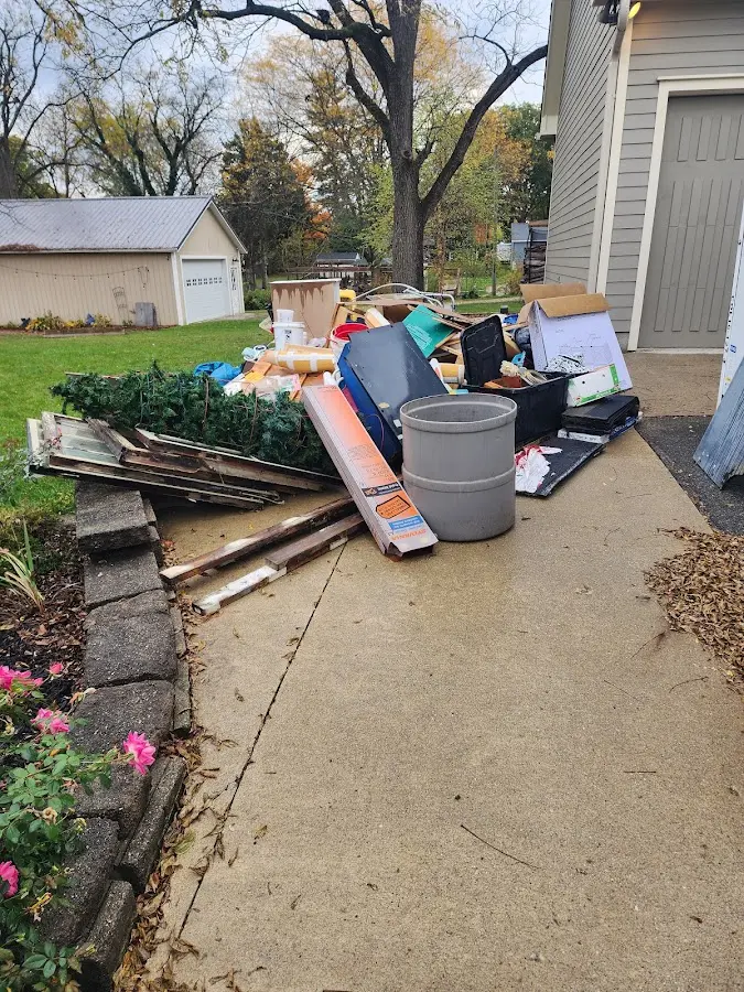 Dumpster being loaded with debris for Roofing Dumpster Rental in Stroud
